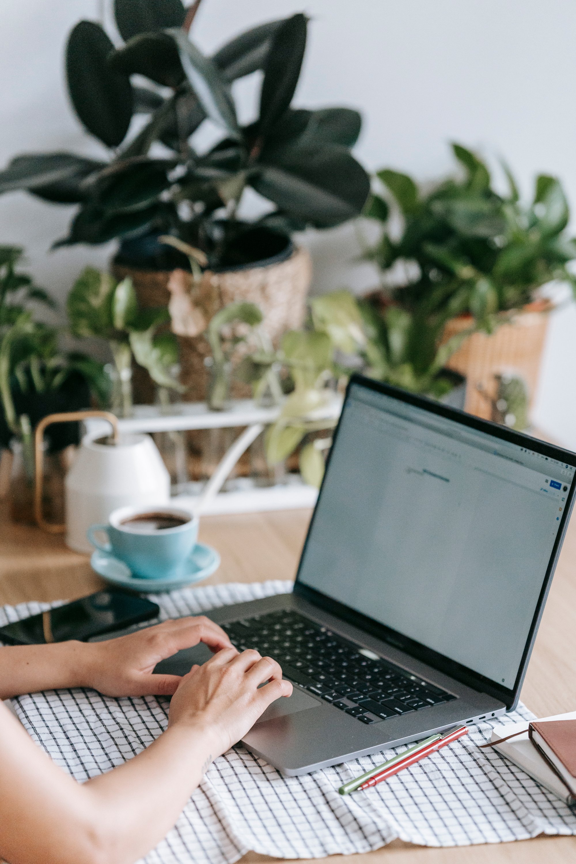 Unrecognizable person typing on laptop